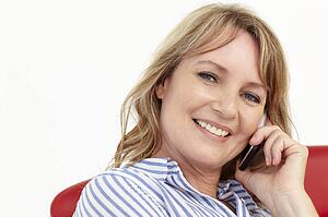 Mid age businesswoman using cellphone