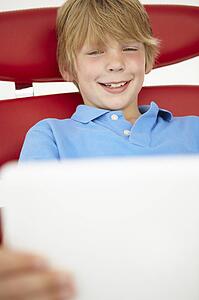 Young boy using laptop