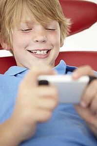 Young boy using cellphone