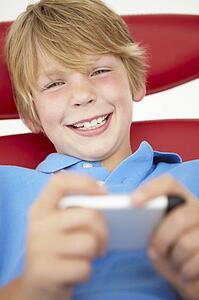 Young boy using cellphone