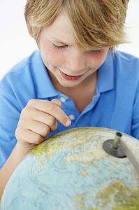 Young boy with globe