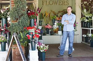 Man standing outside florist