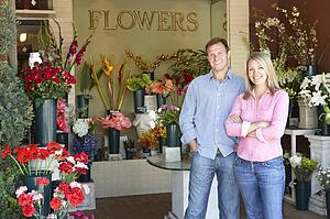 Couple standing outside florist