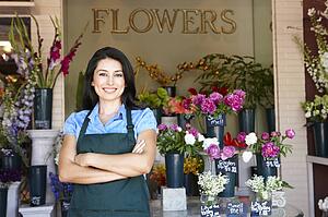 Woman standing outside florist