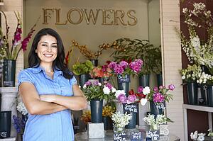 Woman standing outside florist