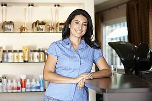 Woman working in hairdressing salon