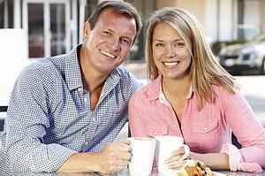Couple sitting at sidewalk cafÃ©