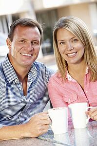 Couple sitting at sidewalk cafÃ©