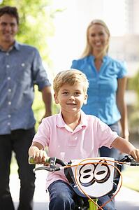 Parents with boy on bike