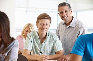 Tutor helping student in class
