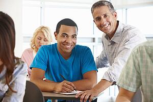 Tutor helping student in class