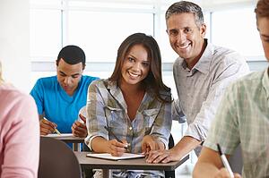 Tutor helping student in class