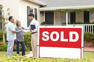 Senior Hispanic couple buying new home