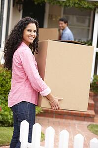 Hispanic couple moving into new house