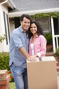 Hispanic couple moving into new house