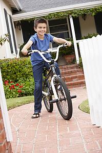 Boy in garden with bike