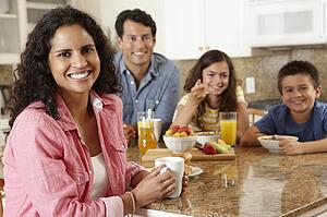 Hispanic family eating breakfast