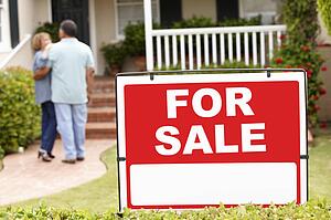 Senior Hispanic couple moving into new home