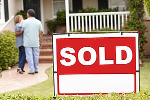 Senior Hispanic couple moving into new home