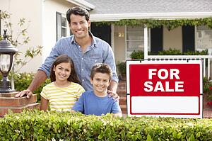 Father and children outside home for sale