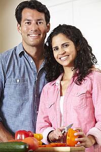 Hispanic couple cooking