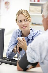 Young doctor with senior patient