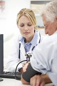 Young doctor with senior patient