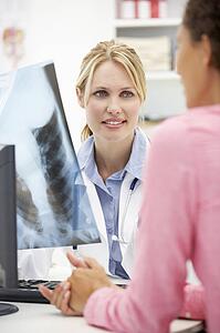 Young doctor with female patient