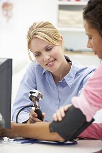 Young doctor with female patient