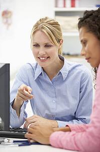 Young doctor with female patient