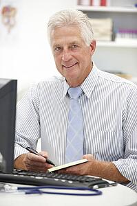 Senior doctor at desk