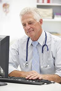 Senior doctor at desk