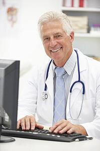 Senior doctor at desk