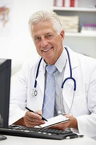 Senior doctor at desk