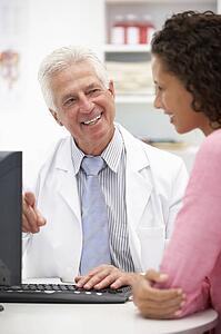 Senior doctor with female patient