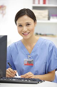 Young hospital doctor at desk