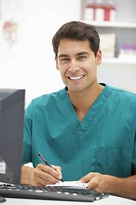 Young hospital doctor at desk