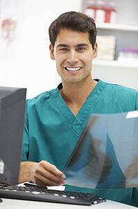 Young hospital doctor at desk