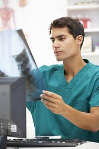 Young hospital doctor at desk