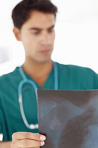 Young male doctor with x-ray