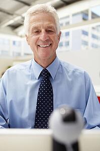Senior businessman using skype