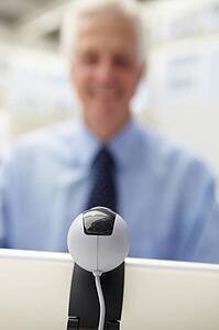 Senior businessman using skype
