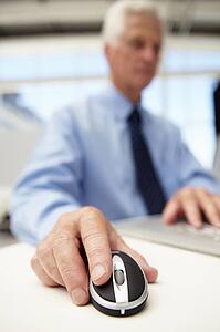 Senior businessman using laptop