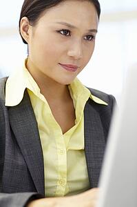 Young businesswoman using laptop