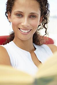 Young woman reading book