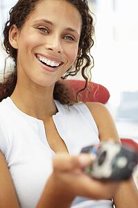 Young woman with remote control