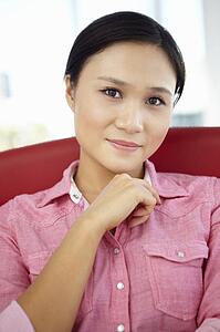 Young woman sitting in chair