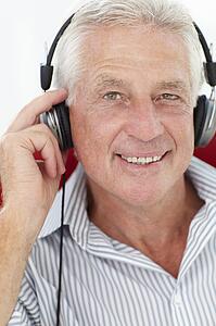 Senior man with headphones