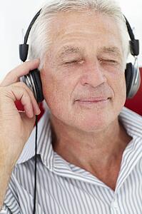 Senior man with headphones