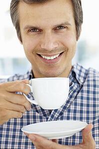 Man relaxing with cup of tea